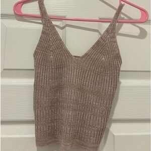 Looks very brown/tan in the photos but is more pinky in person!